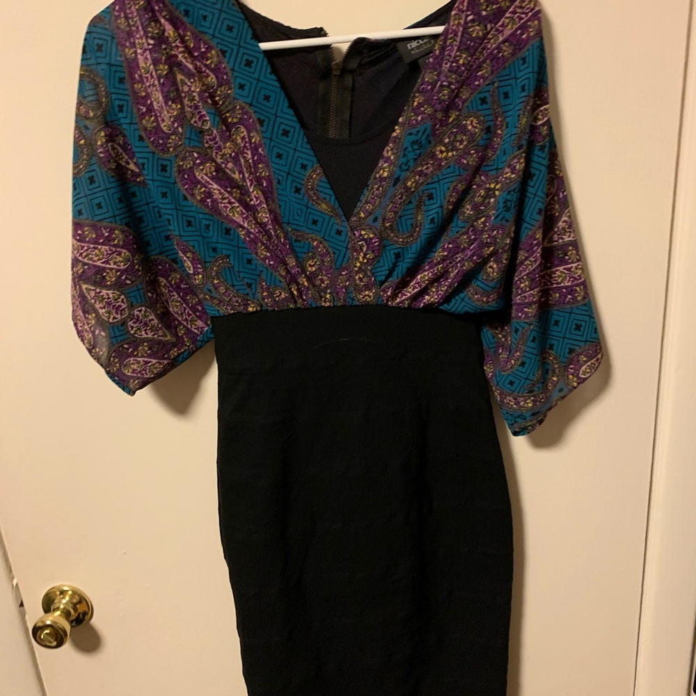 Only worn a couple times. Form fitting and very nice
